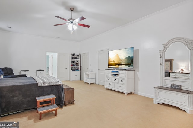 carpeted bedroom featuring ceiling fan and ornamental molding