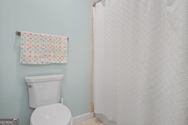 1565 Mountain Shadow Trl, Stone Mountain, GA 30087 - bathroom with tile patterned flooring, toilet, and a shower with shower curtain