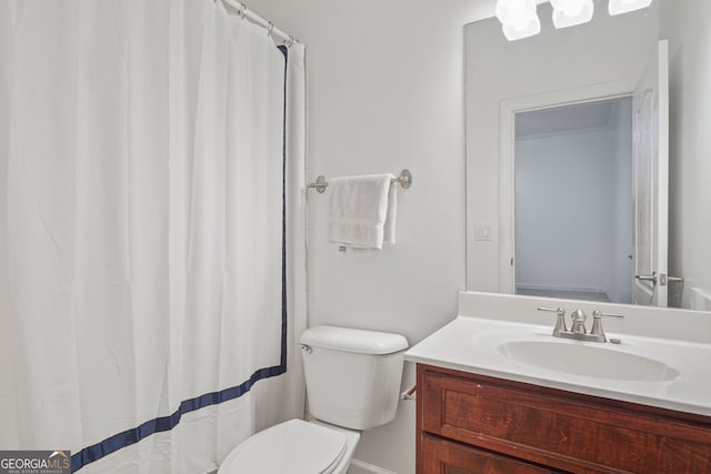 bathroom featuring vanity, toilet, and a shower with shower curtain