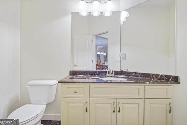 1565 Mountain Shadow Trl, Stone Mountain, GA 30087 - bathroom featuring toilet, vanity, and baseboards