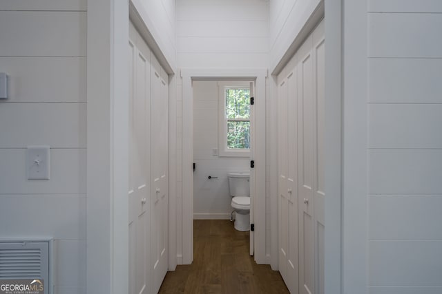 bathroom with wood-type flooring and toilet