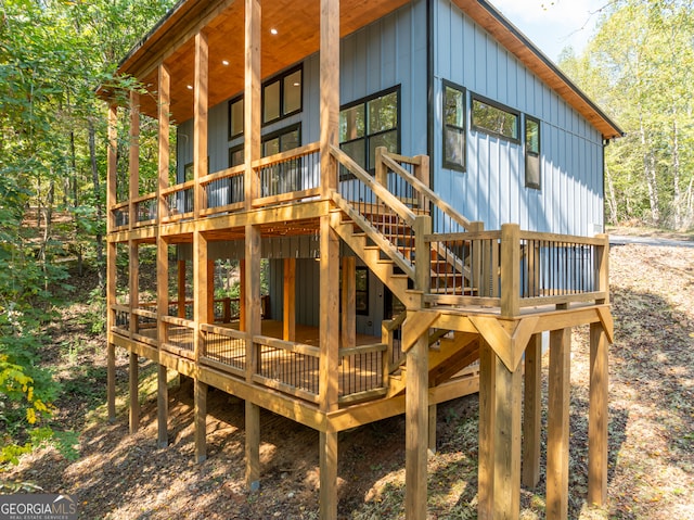 rear view of property with a wooden deck