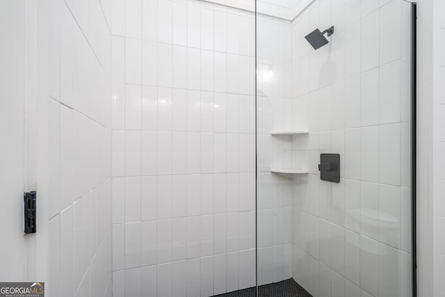 bathroom with a tile shower