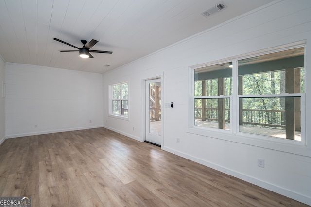 unfurnished room with wood ceiling, crown molding, light hardwood / wood-style flooring, and ceiling fan