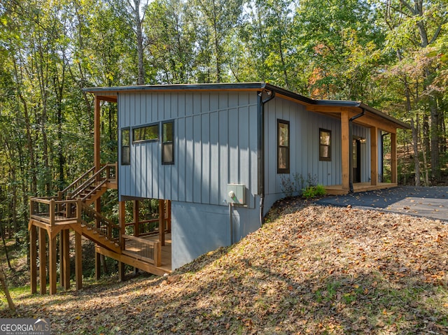 view of side of home with a patio area