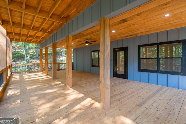 wooden deck featuring ceiling fan