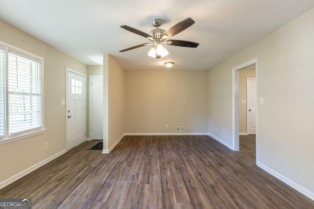 interior space featuring ceiling fan and dark wood-type flooring