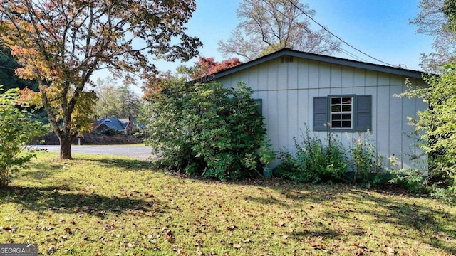 view of property exterior featuring a yard