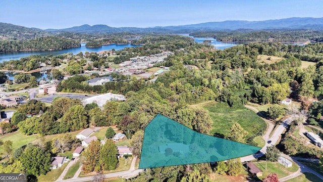 bird's eye view with a water and mountain view