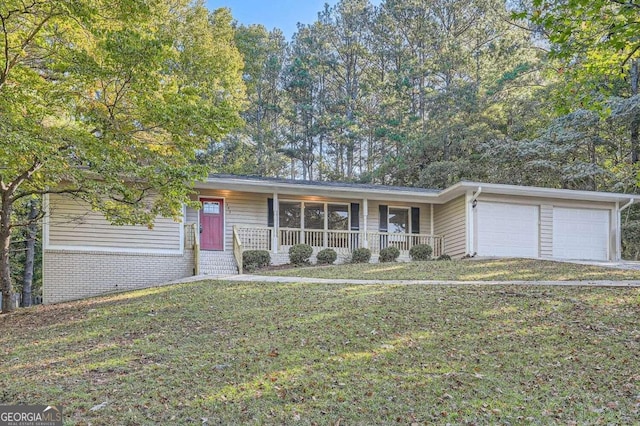 ranch-style home with a garage, a porch, and a front yard