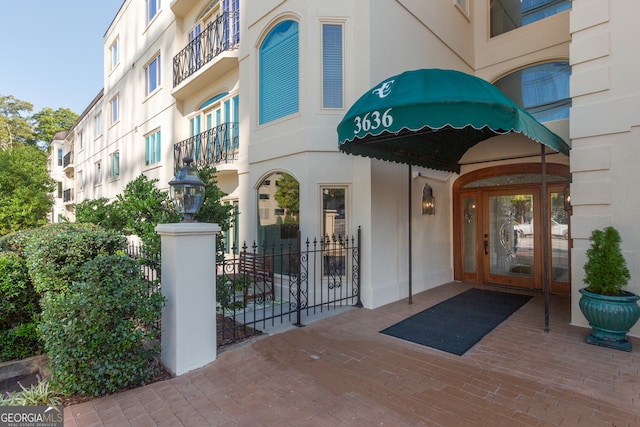 entrance to property featuring french doors