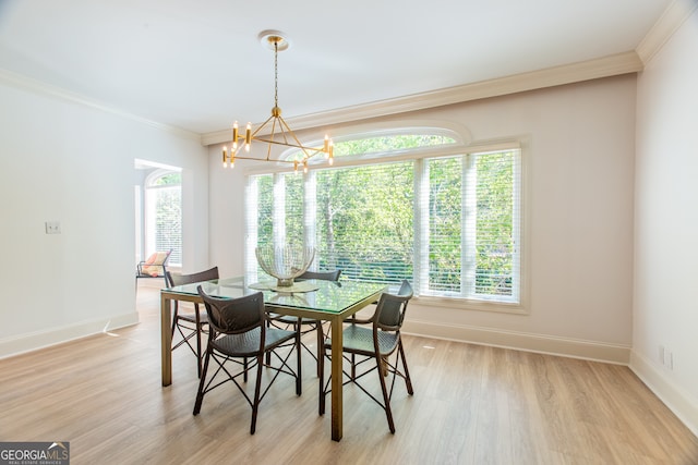 dining area with ornamental molding, a healthy amount of sunlight, and light hardwood / wood-style floors