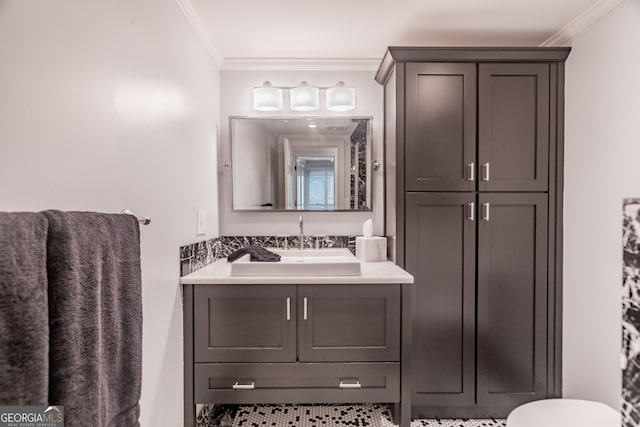 bathroom with crown molding, toilet, and vanity