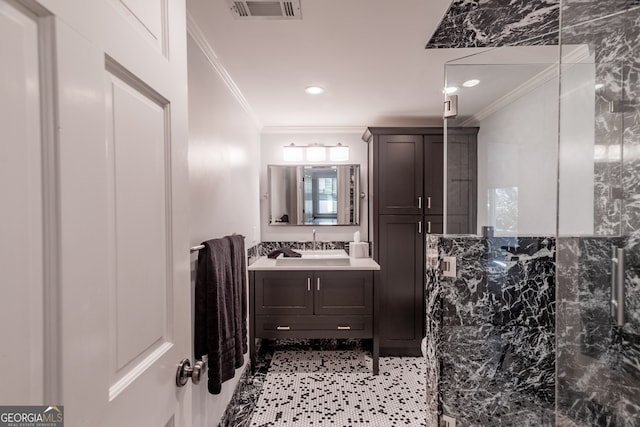 bathroom with walk in shower, vanity, tile walls, and crown molding