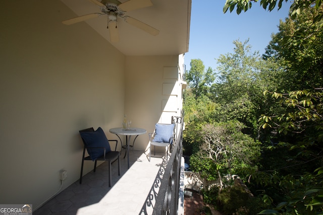 balcony featuring ceiling fan and a patio