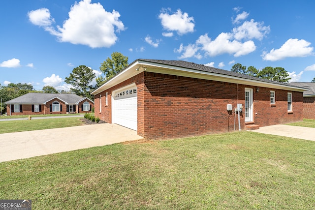 view of property exterior with a garage and a yard