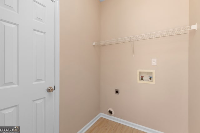 washroom with washer hookup, hardwood / wood-style flooring, and electric dryer hookup