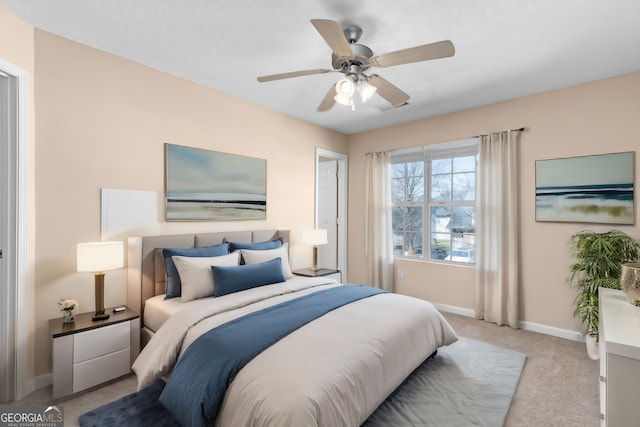 carpeted bedroom featuring ceiling fan