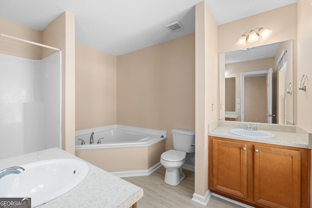 full bathroom with independent shower and bath, wood-type flooring, vanity, and toilet