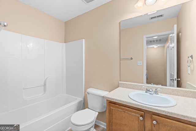 full bathroom with tub / shower combination, vanity, and toilet