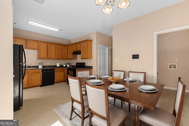 dining area with light hardwood / wood-style flooring