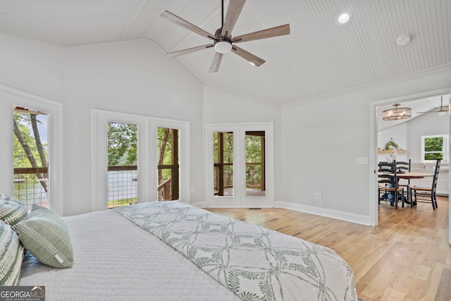 bedroom with light hardwood / wood-style floors, access to exterior, and multiple windows