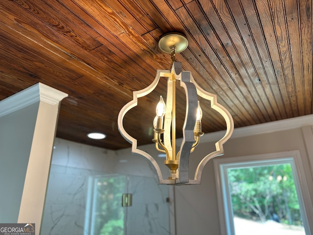 room details featuring ornamental molding and wooden ceiling