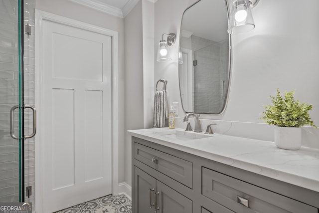 bathroom with ornamental molding, an enclosed shower, and vanity