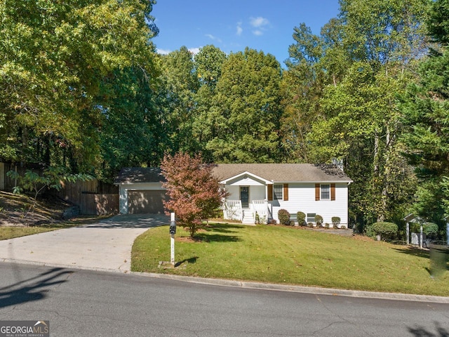 view of front of property featuring a front yard and a garage