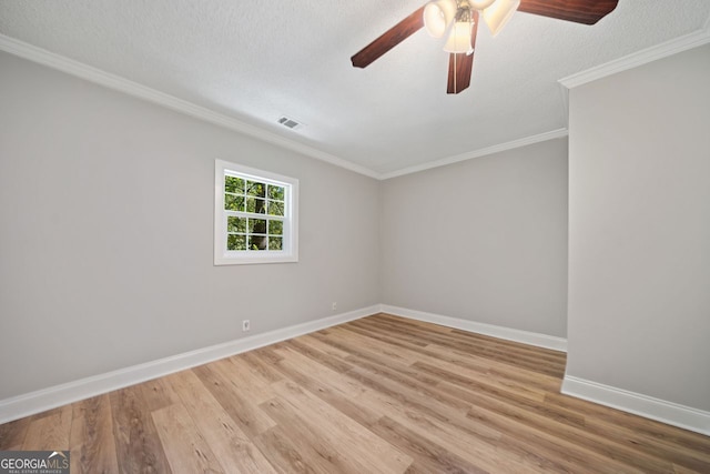 unfurnished room featuring crown molding, a textured ceiling, light hardwood / wood-style floors, and ceiling fan