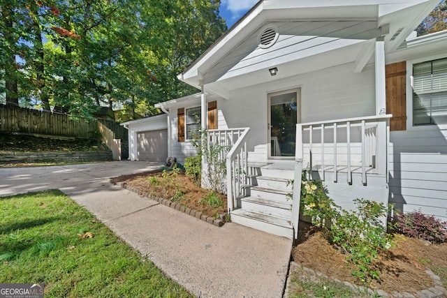 view of front of house with covered porch and a garage