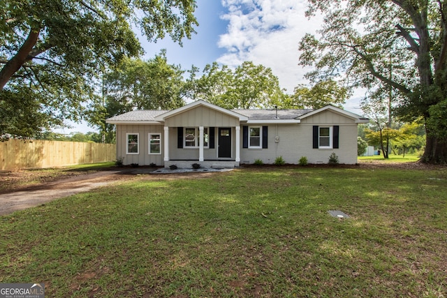 ranch-style house with a front lawn