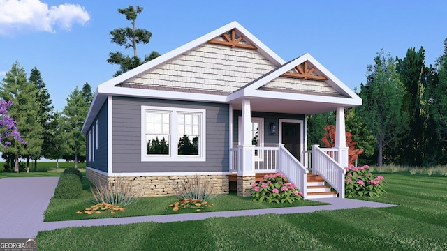 craftsman-style home featuring covered porch and a front yard