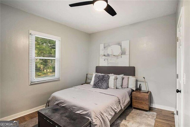 bedroom featuring hardwood / wood-style floors and ceiling fan