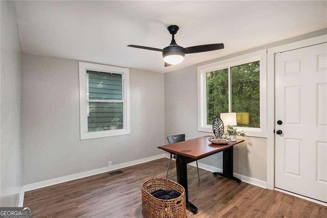 office featuring ceiling fan, baseboards, and wood finished floors