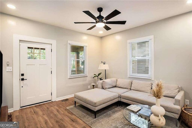 living area with ceiling fan, visible vents, recessed lighting, wood finished floors, and baseboards