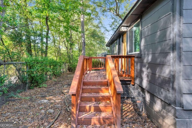 wooden deck with stairway and fence