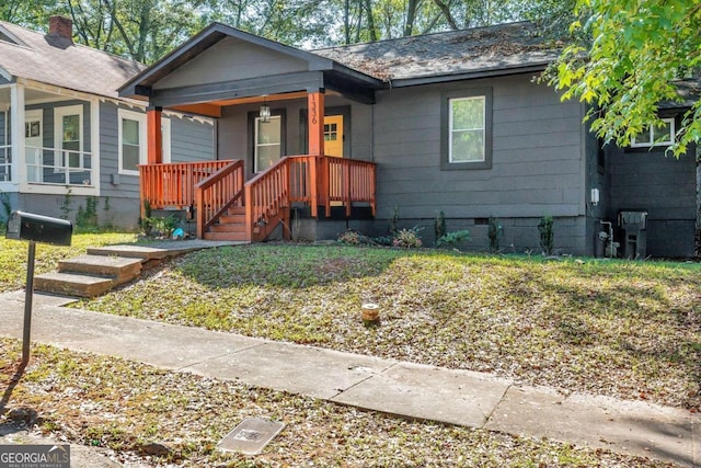 view of front facade with a porch and crawl space