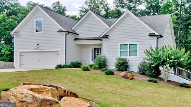 view of front of house featuring a garage and a front yard