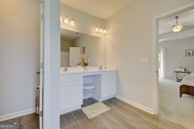 bathroom with vanity and hardwood / wood-style flooring