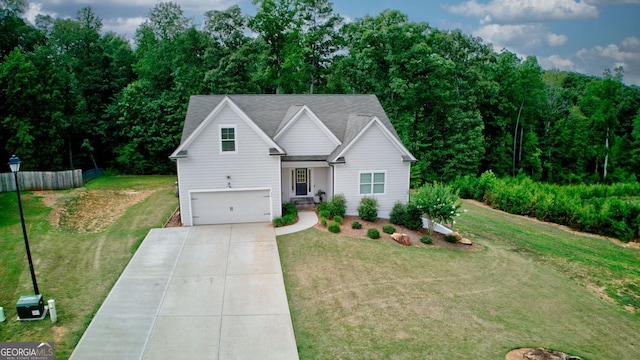 view of front of home with a front yard and a garage