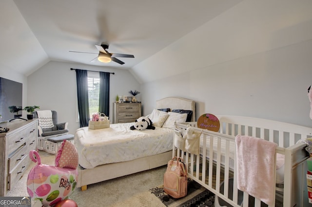 bedroom with vaulted ceiling, carpet flooring, and ceiling fan