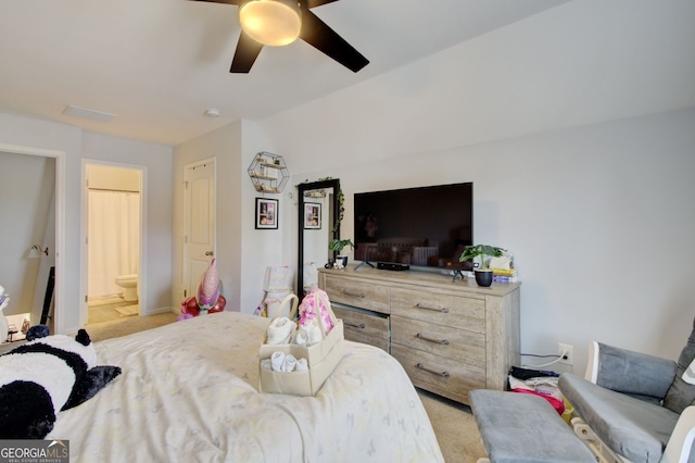 carpeted bedroom with ceiling fan and connected bathroom