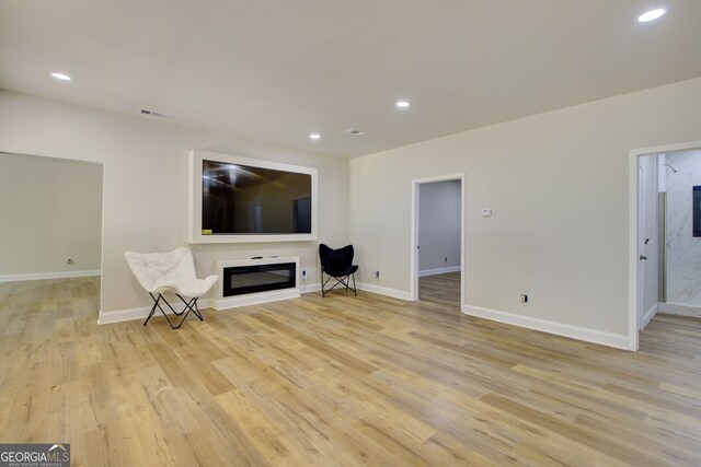 unfurnished living room featuring light wood-type flooring