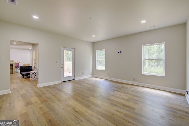 spare room featuring light hardwood / wood-style flooring