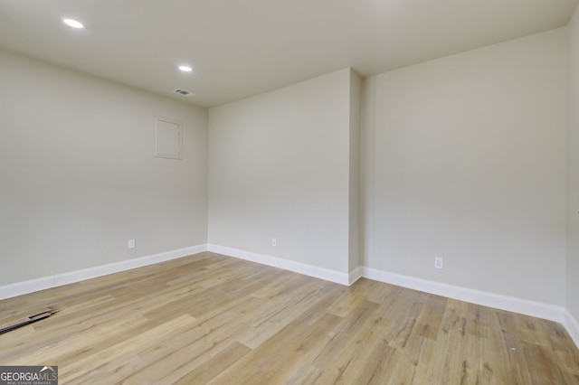 spare room with light hardwood / wood-style flooring