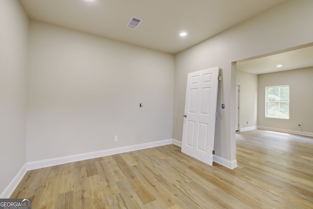 spare room featuring light hardwood / wood-style floors