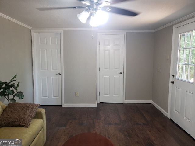 interior space with ceiling fan, crown molding, and dark hardwood / wood-style flooring