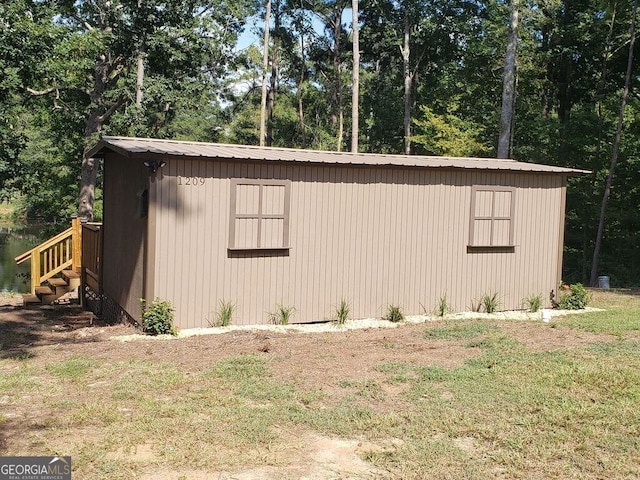 view of outdoor structure with a lawn