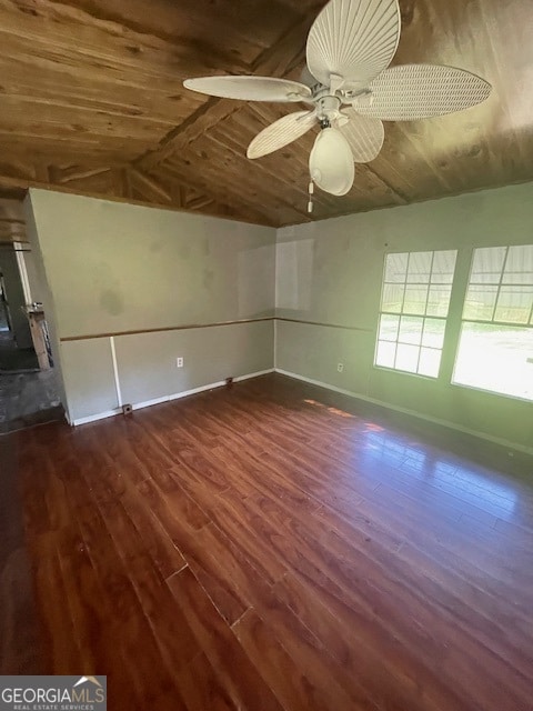 unfurnished room featuring dark hardwood / wood-style flooring, ceiling fan, lofted ceiling, and wood ceiling